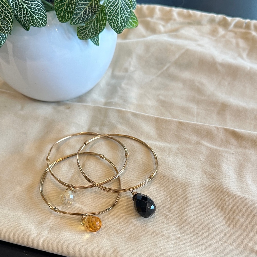 Elegant Gold Bangle Set with Black and Amber Accents